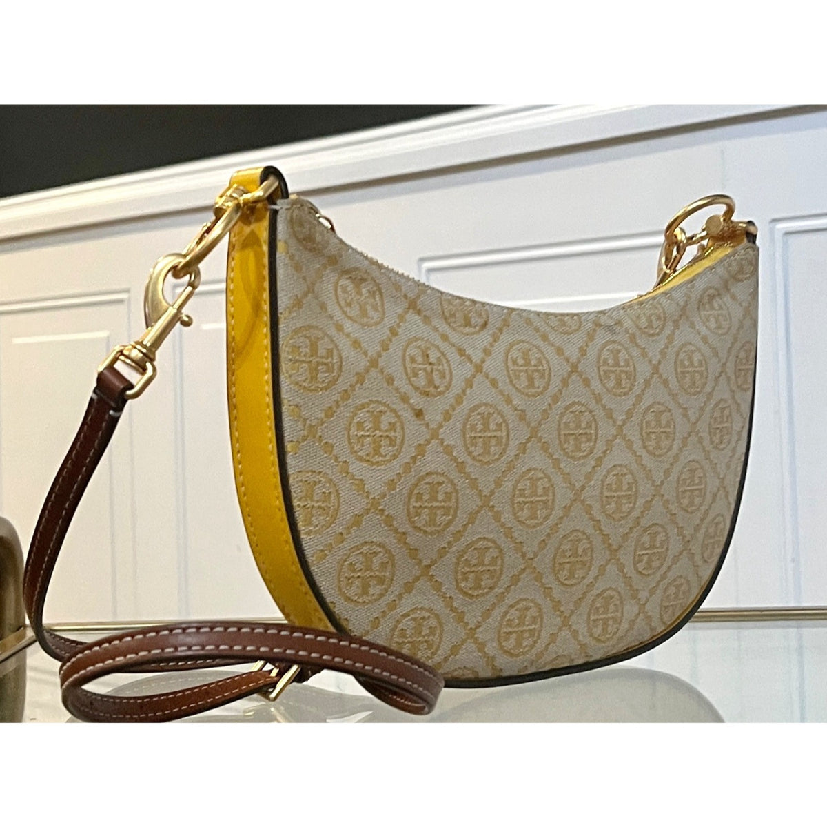 Tory Burch Monogram Half-Moon Crossbody Bag With Adjustable Strap In Yellow & Brown